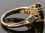 side view of moldavite tsavorite garnet and green diamond ring in 10k yellow gold