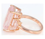 side view of emerald cut rose quartz trilogy ring in 18k rose gold over sterling silver