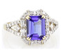 front view of emerald cut tanzanite and diamond halo ring in 14k yellow gold
