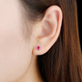 untreated natural oval ruby stud earrings in 14k rose gold