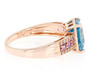 side view of blue zircon pink sapphire and white zircon ring in 10k rose gold