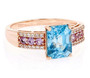 front view of blue zircon pink sapphire and white zircon ring in 10k rose gold