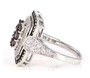side view of brown and white cubic zirconia ring in black and white rhodium over sterling silver
