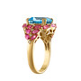 side view of swiss blue topaz pink topaz and diamond halo ring in 14k yellow gold