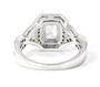 back view of emerald and round cubic zirconia engagement ring in 18k yellow gold and rhodium over sterling silver
