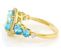 side view of blue and white cubic zirconia ring in 18k yellow gold over sterling silver