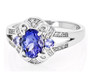 front view of tanzanite and white zircon split shank ring in rhodium over sterling silver