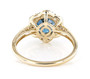 london blue topaz and champagne diamond halo ring in 10k yellow gold