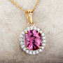 pink spinel and white diamond halo pendant necklace in solid 18k yellow gold shown in a lifestyle photo