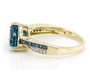 side view of london blue trillion topaz blue and white diamond ring in 10k yellow gold