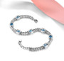 swiss blue topaz and white zircon bracelet in rhodium over sterling silver