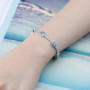 Swiss Blue Topaz & White Zircon Bracelet in Rhodium over Sterling Silver 7.5ctw