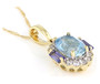 angled view of aquamarine tanzanite and zircon pendant necklace in 10k yellow gold