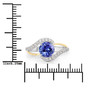 tanzanite and diamond open bypass ring in two-tone 14k white and yellow gold shown for size comparison