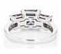 back view of blue and white moissanite three stone ring in rhodium over sterling silver
