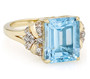 front view of emerald cut sky blue topaz and white zircon ring in 18k yellow gold over sterling silver
