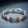 close up of garnet bracelet in rhodium over sterling silver
