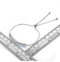 aquamarine and zircon bolo bracelet in rhodium over sterling silver shown for size comparison
