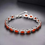 carnelian and oval white zircon halo tennis bracelet in rhodium over sterling silver