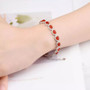 carnelian and white zircon oval halo rhodium over sterling silver tennis bracelet on wrist model