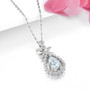 aquamarine and zircon bow pendant necklace in rhodium over sterling silver shown in a lifestyle photo