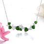chrome diopside and zircon heart bar necklace in rhodium over sterling silver shown in a lifestyle photo