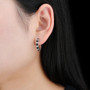 black spinel and zircon hoop earrings in rhodium over sterling silver worn on the ear