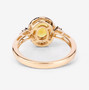 back view of yellow sapphire and white diamond halo ring in 14k yellow gold