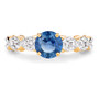 front view of round blue sapphire and diamond ring in 14k yellow gold