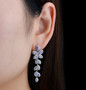 tanzanite dangle earrings in rhodium over sterling silver