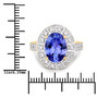 oval tanzanite and diamond halo ring in 14k yellow gold shown for size comparison