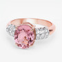 side view of pink tourmaline and diamond ring in 14k rose gold