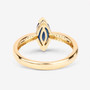back view of marquise cut blue sapphire and white diamond ring in 14k yellow gold