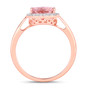 full view of pear cut morganite and diamond halo ring in 14k rose gold