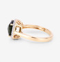 side view of square cushion cut green tourmaline and diamond halo ring in 14k yellow gold