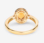 back view of spessartine garnet and diamond halo ring in 14k yellow gold