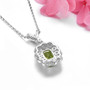 back view of peridot and white zircon halo pendant necklace in rhodium over sterling silver