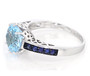 side view of sky blue topaz and blue sapphire ring in rhodium over sterling silver