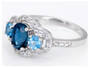 side view of london blue topaz and swiss blue topaz lab white sapphire halo three stone ring in rhodium over sterling silver