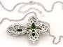back view of chrome diopside and black spinel cross necklace in black and white rhodium over sterling silver