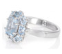 side view of aquamarine halo ring in rhodium over sterling silver