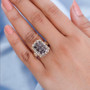 color change garnet and zircon cluster two-tone yellow gold and rhodium over sterling silver ring worn on a hand