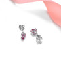 close up of 6x4mm oval ruby stud earrings in rhodium over sterling silver