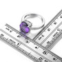 oval amethyst and white zircon ring in rhodium over sterling silver shown for size comparison
