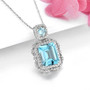 side view of sky blue topaz and white zircon pendant necklace in rhodium over sterling silver
