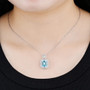 sky blue topaz and white zircon pendant necklace in rhodium over sterling silver worn around the neck