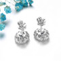 back view of blue sapphire and white zircon halo stud earrings in rhodium over sterling silver