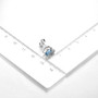 blue topaz and white zircon heart stud earrings in rhodium over sterling silver shown for size comparison