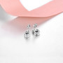 back view of blue topaz and white zircon heart stud earrings in rhodium over sterling silver