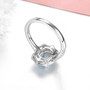back view of aquamarine and white zircon halo ring in rhodium over sterling silver